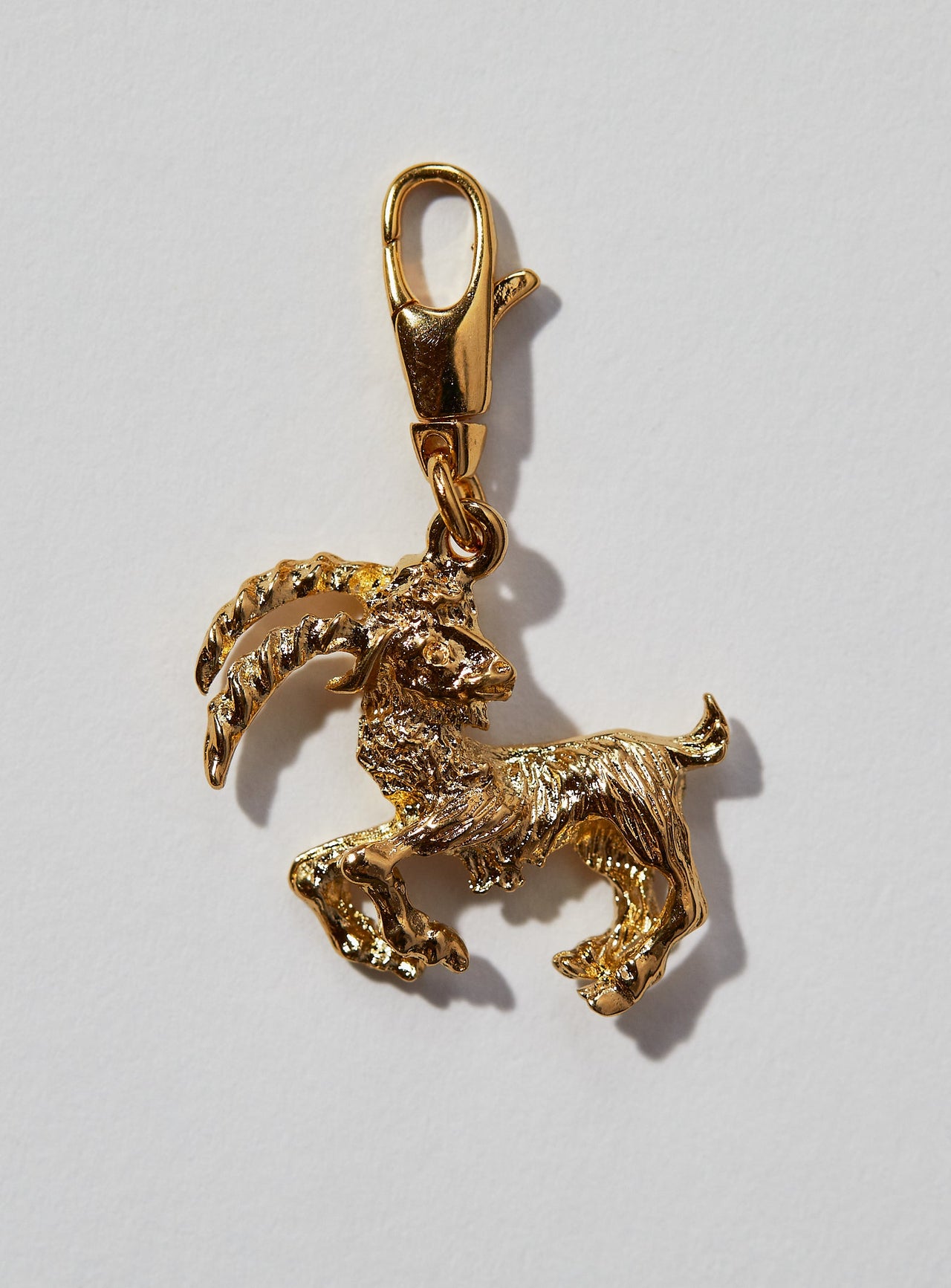 Capricorn Zodiac Charm: This 3 dimensional pendant comes in 22k gold or rhodium electroplate and a swivel lobster clasp for the best possible displaying of your astrological self. This zodiac charm is perfect for adding onto our zodiac necklace or any other necklace or bracelet. See other product listings for necklaces and bracelets. If not in stock, item takes approximately 4-8 weeks to produce. Feel free to email info@paricijewellery.com to see if item is currently in stock.