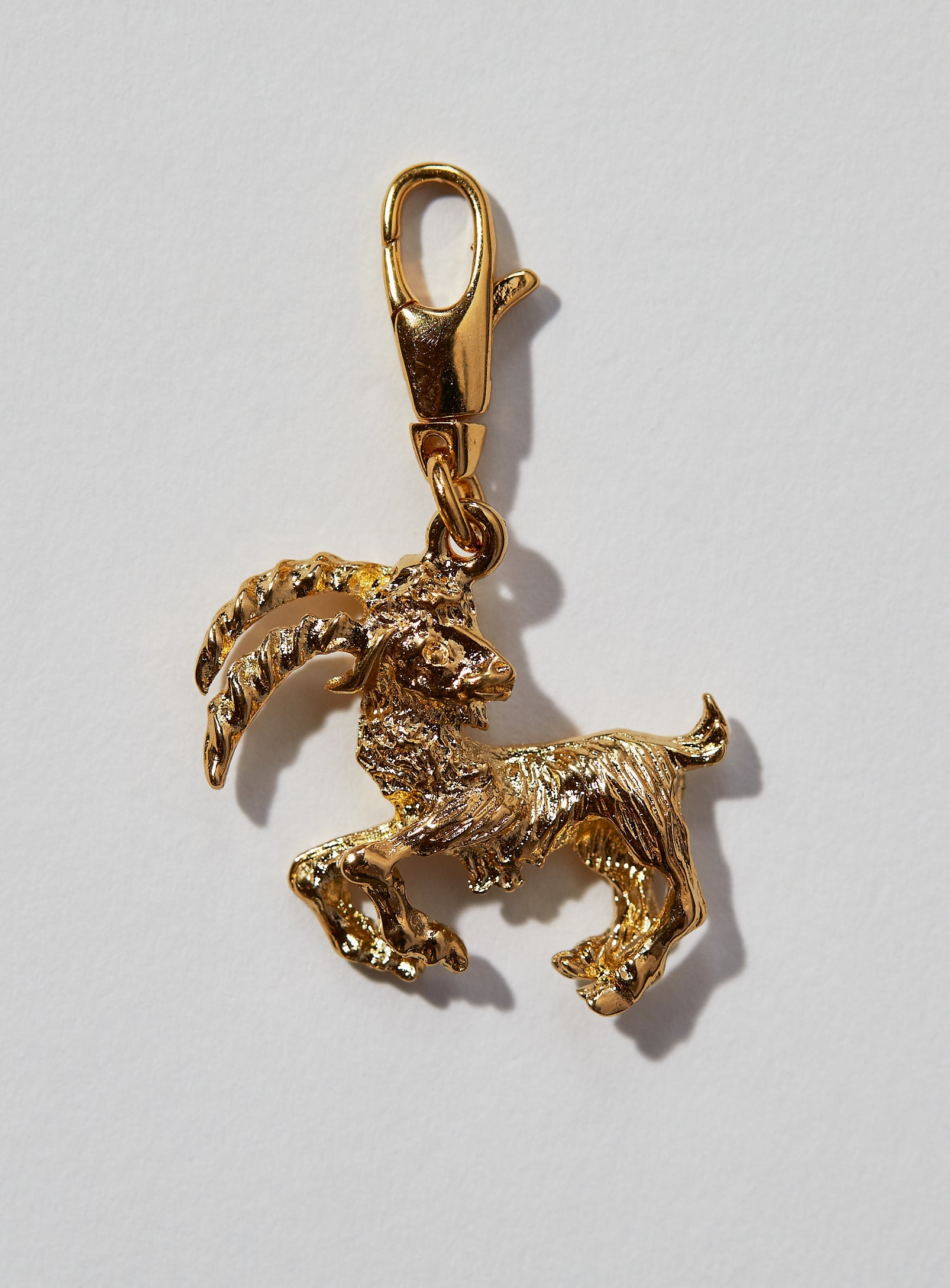 Capricorn Zodiac Charm: This 3 dimensional pendant comes in 22k gold or rhodium electroplate and a swivel lobster clasp for the best possible displaying of your astrological self. This zodiac charm is perfect for adding onto our zodiac necklace or any other necklace or bracelet.  See other product listings for necklaces and bracelets.   If not in stock, item takes approximately 4-8 weeks to produce. Feel free to email info@paricijewellery.com to see if item is currently in stock.