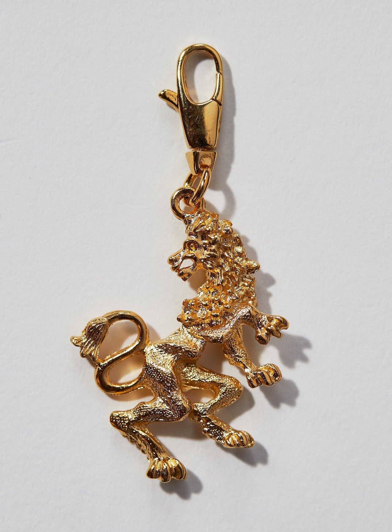 Leo Zodiac Charm: This 3 dimensional pendant comes in 22k gold or rhodium electroplate and a swivel lobster clasp for the best possible displaying of your astrological self. This zodiac charm is perfect for adding onto our zodiac necklace or any other necklace or bracelet. SEE OUR OTHER PRODUCT LISTINGS TO BUY THE CHAIN If not in stock, item takes approximately 4-8 weeks to produce. Feel free to email info@paricijewellery.com to see if item is currently in stock.